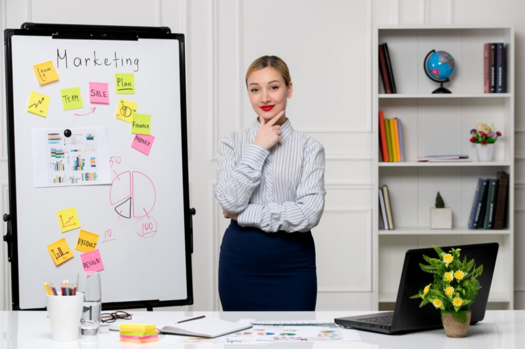 marketing business lady in office standing and smiling